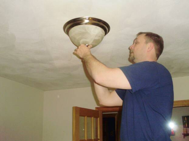 Massachusetts electricians installing lighting systems.